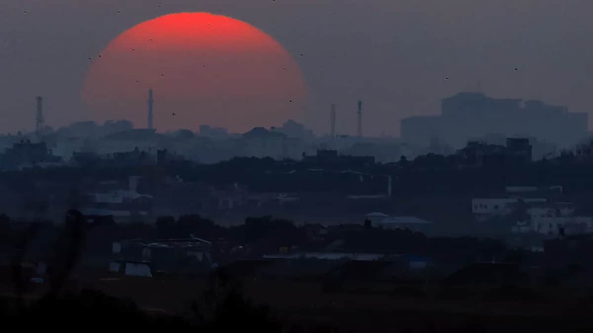 Smoke rises over the Hamas-administered Gaza Strip following an Israeli airstrike. Photo: EPA-EFE / HANNIBAL HANSCHKE