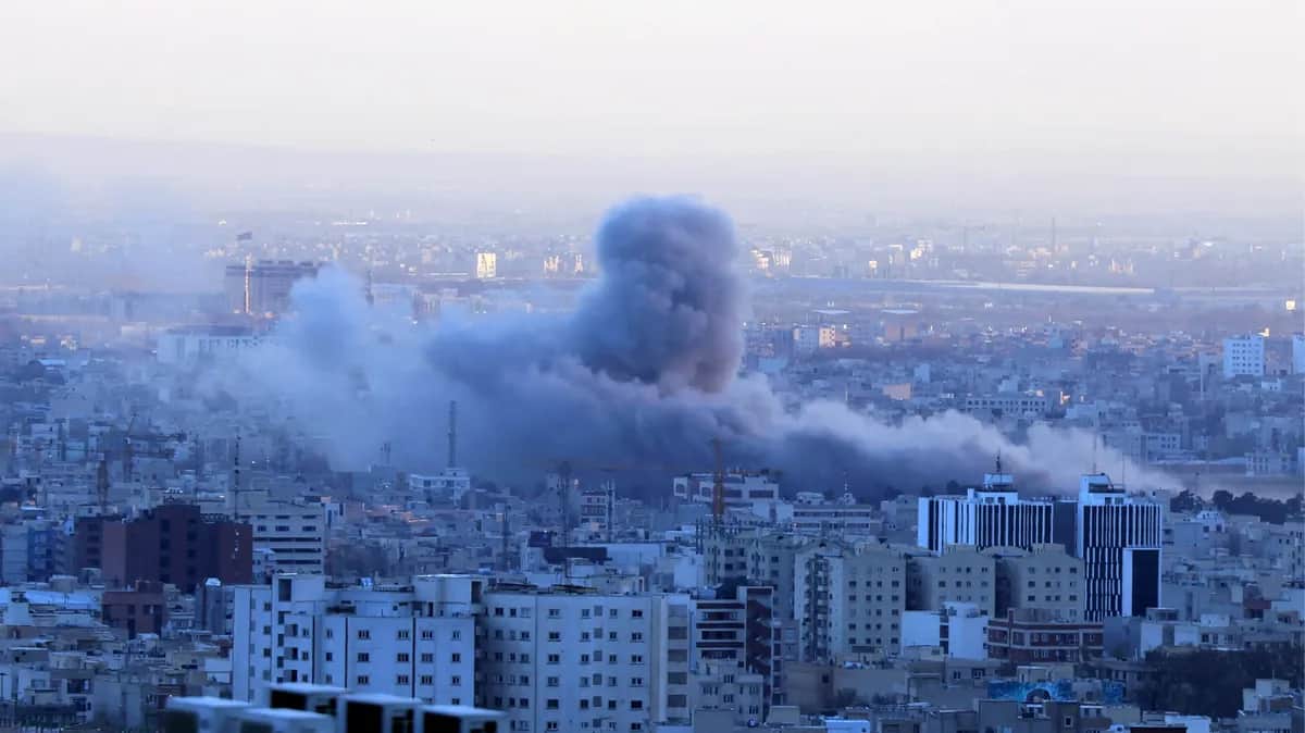Smoke rises over central Tehran following an airstrike on 3 March 2026. Photo: EPA / Abedin Taherkenareh