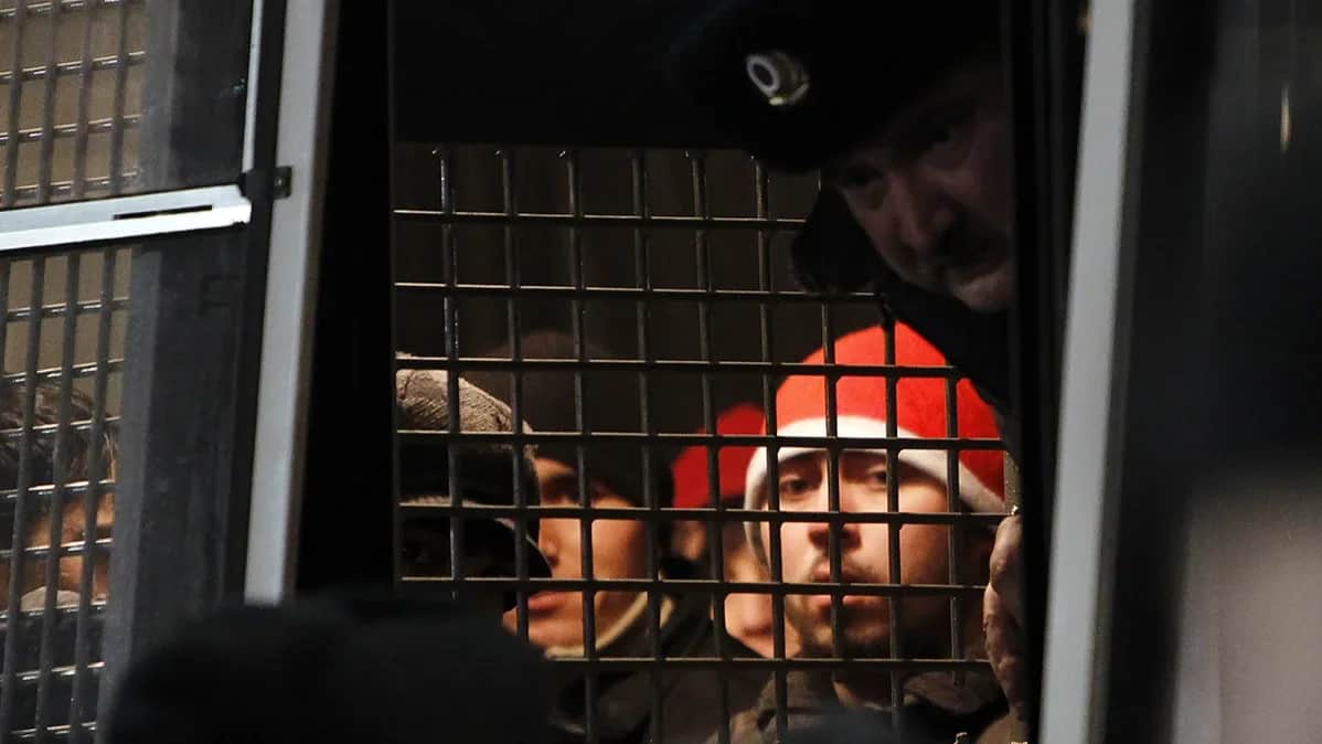 Detained migrant workers from Central Asia on a police bus in Moscow. Photo: Enis Sinyakov / Reuters / Scanpix / LETA