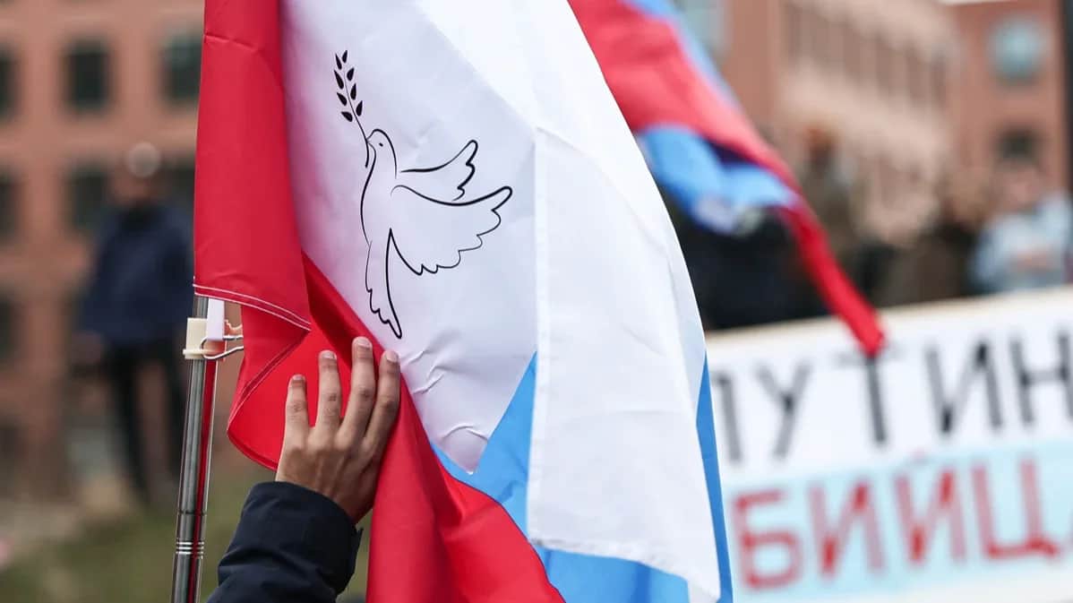 A Russian flag at a protest in Berlin, 1 March 2025. Photo: Hannes P Albert / dpa / Scanpix / LETA
