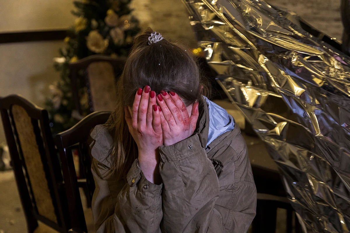 Another rocket attack on Kharkiv on 10 January 2024 killed at least 10 people. Photo: An injured woman in the aftermath of the attack. EPA-EFE/SERGEY KOZLOV