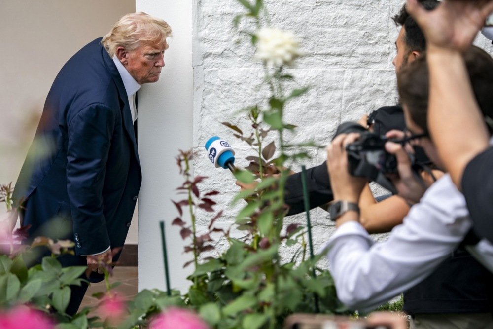Donald Trump stops to speak to reporters near the Rose Garden of the White House in Washington, 29 July 2025. Photo: EPA/BONNIE CASH / POOL