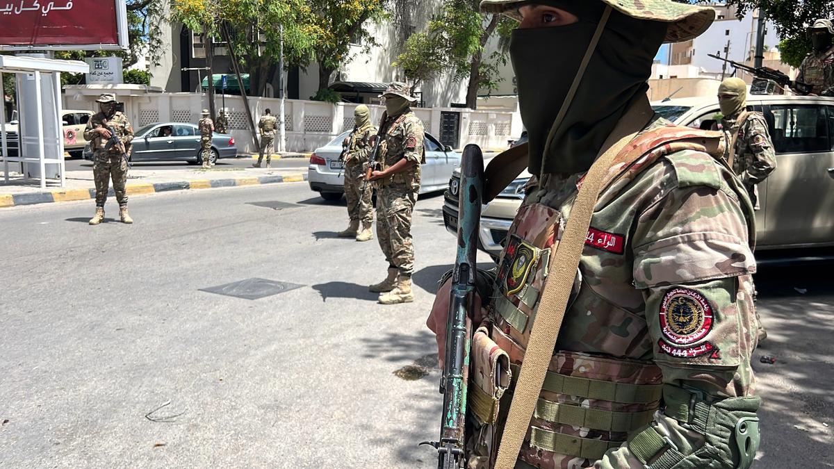 Libyan soldiers guard at a checkpoint following overnight clashes in Tripoli, Libya, 13 May 2025. Photo: EPA