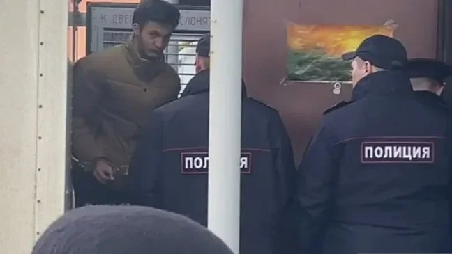 Yegor Yurchenko being led into court. Photo: Pavel Sidorov / URA.ru
