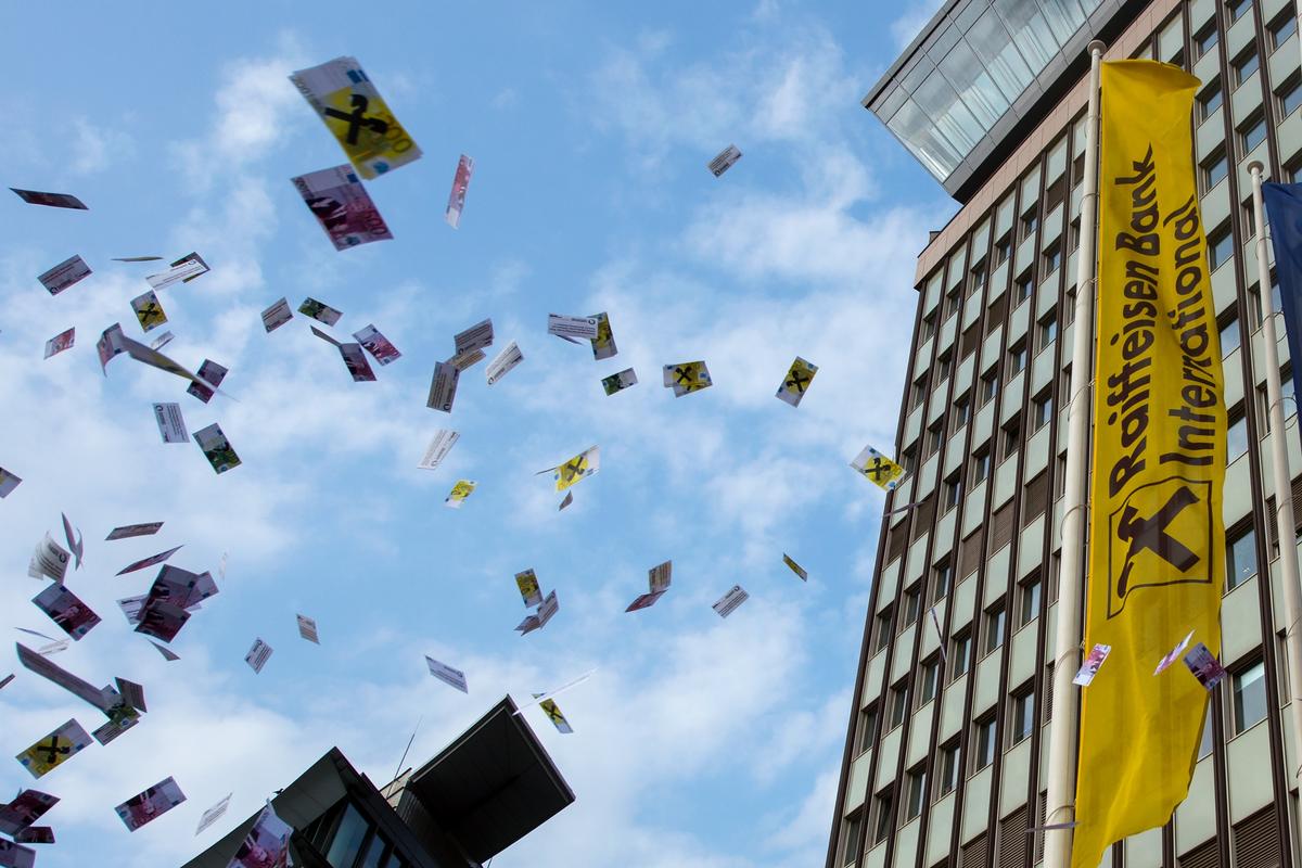 A protest against money laundering in front of the headquarters of Raiffeisen Bank International in Vienna, Austria, 6 April 2016. Photo: EPA / Christian Bruna
